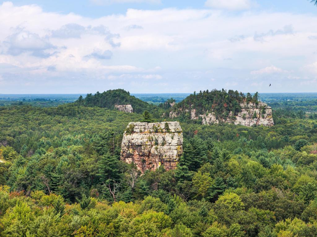 Mill Bluff State Park, Wisconsin, USA with a view of trees and large rocks.