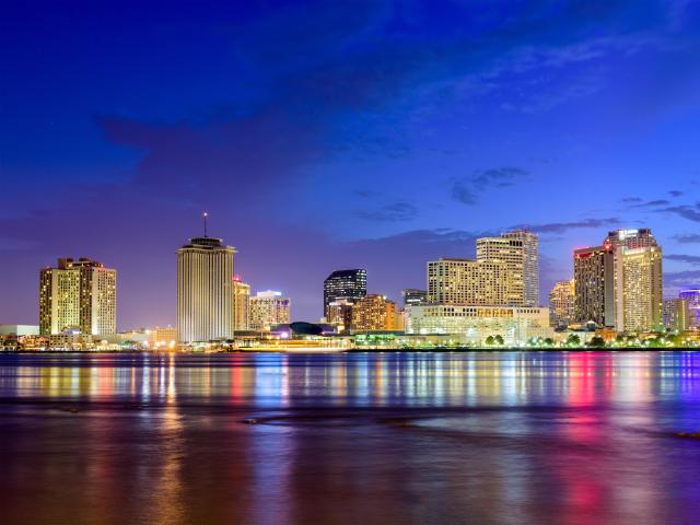 New Orleans, Louisiana, USA skyline on the Mississippi River taken at sunset.