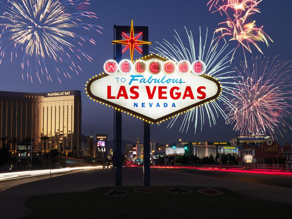 Lighted sign reading Welcome to Fabulous Las Vegas Nevada with fireworks in background