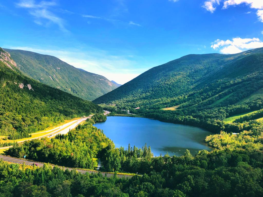 Franconia Notch State Park, New Hampshire, USA taken at Echo Lake with the White Mountains and the foot of Cannon Mountain on a sunny day.