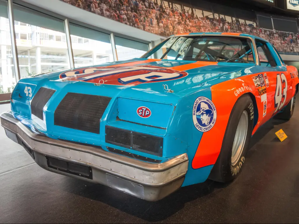 A legendary blue and orange race car on display in Charlotte's NASCAR Hall of Fame, NC