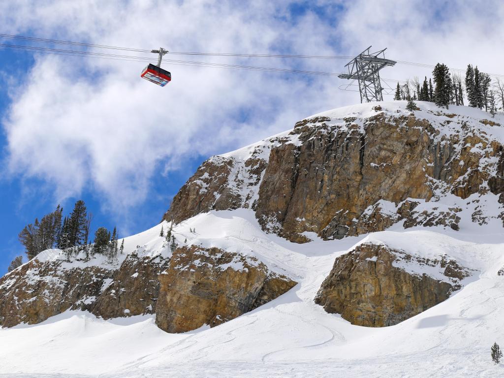 Snowy mountain side and soaring ski tram in Jackson Hole, Wyoming