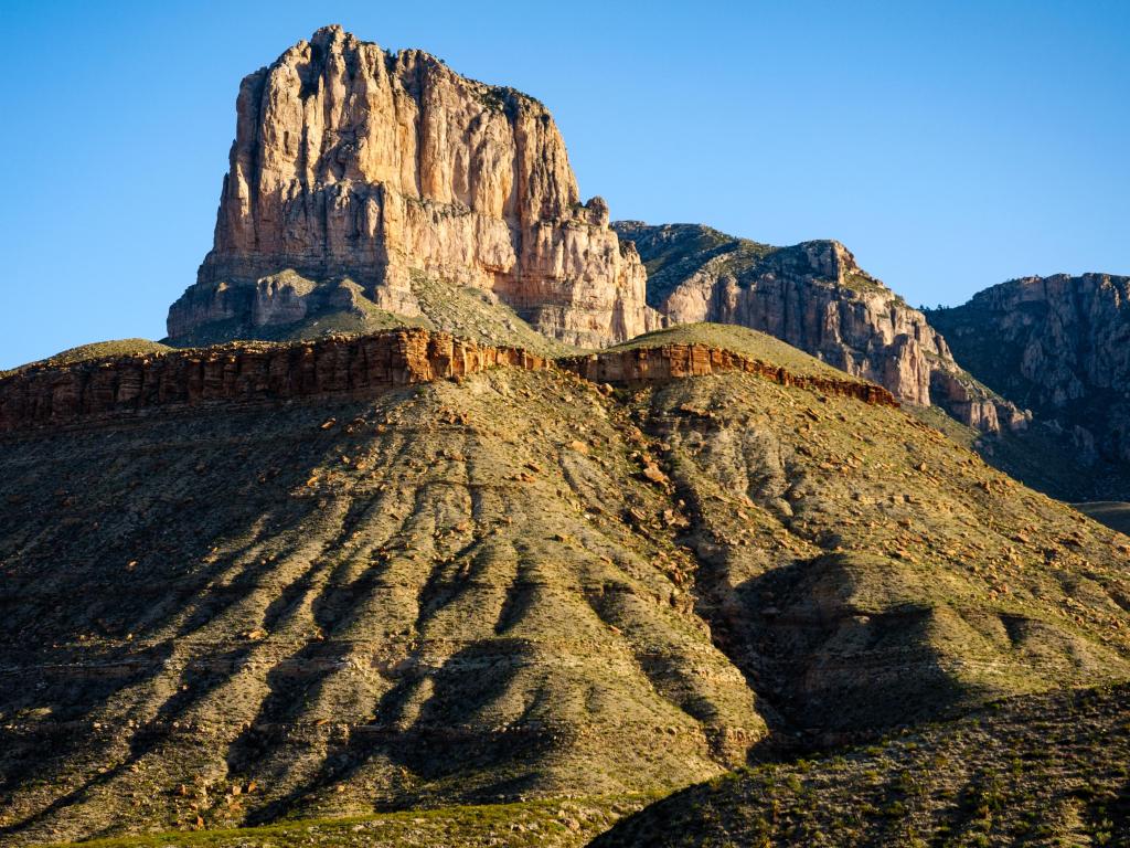 Tall Butte cathcing the daylight on a sunny day with blue skies at Guadalupe Mountains National Park