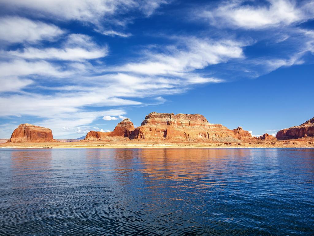 Lake Powell, Page, USA view of the lake and red cliffs in the distance on a clear sunny day.