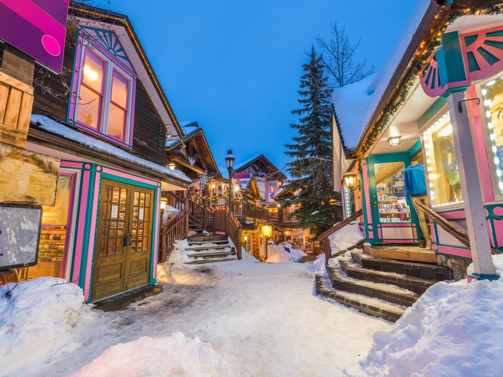 Breckenridge, Colorado, USA downtown streets at night in the winter with holiday lighting.