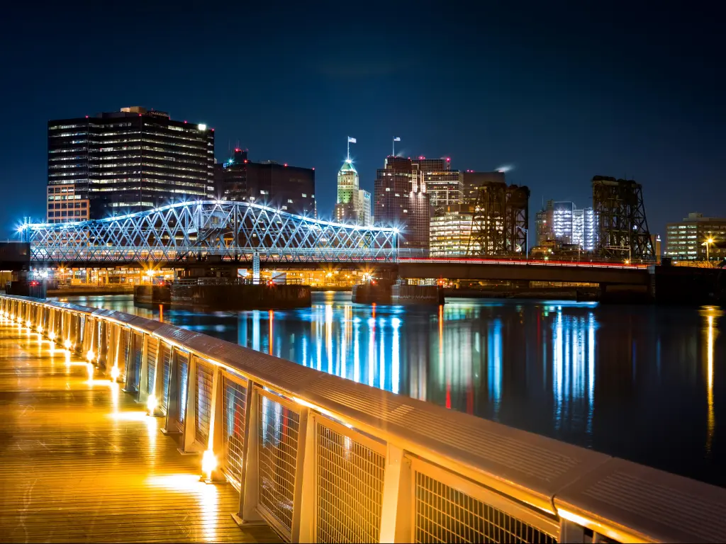 Newark, NJ cityscape by night, viewed from Riverbank park. Jackson street bridge
