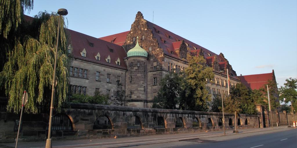 The grey brick exterior of the Palace of Justice, Nuremberg, on a sunny day