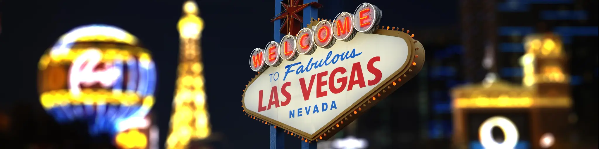 Welcome to Fabulous Las Vegas Neon Sign. Intentional Blurred Las Vegas Strip In Background