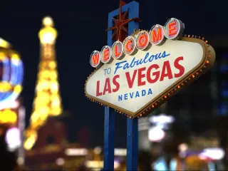 Welcome to Fabulous Las Vegas Neon Sign. Intentional Blurred Las Vegas Strip In Background