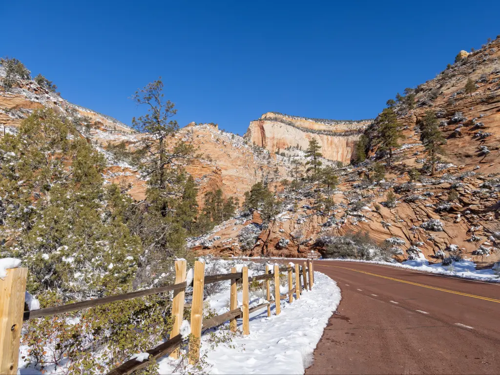 Scenic winter landscape in Zion National Park, with rocks and road dusted with snow, Utah