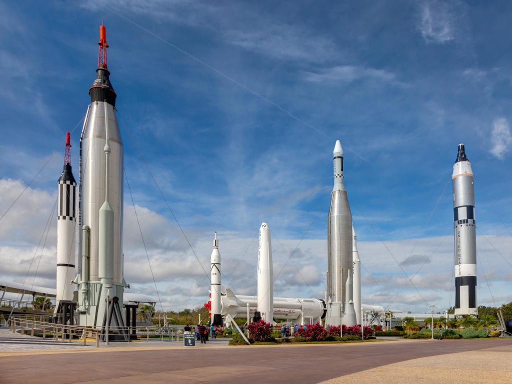 Apollo rockets stand tall against a blue sky in the Rocket Garden at Kennedy Space Center, Cape Canaveral