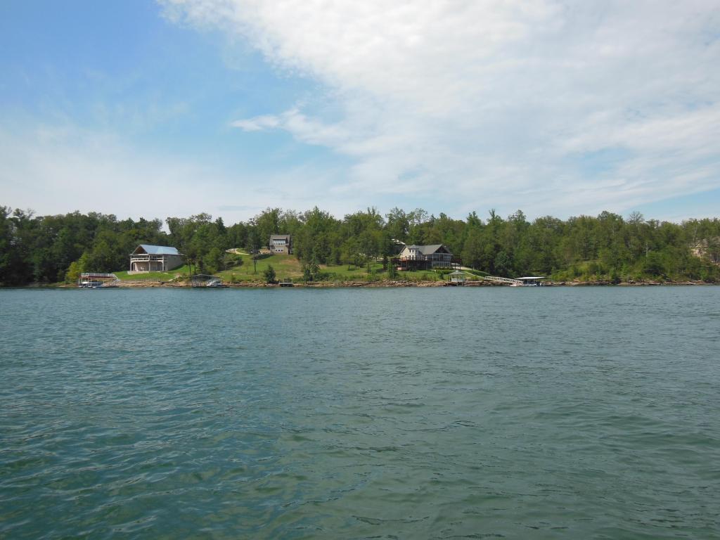 A view of the houses across Lewis Smith Lake on a bright day