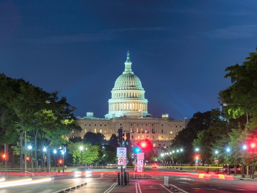 US Capitol Building at night as seen from Pennsylvania Avenue in Washington DC.