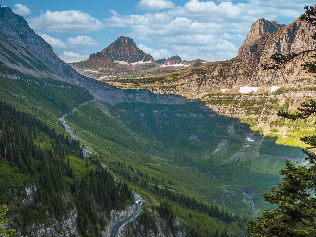 Going to the Sun Road, Montana, USA with a scenic trail showing views of the Glacier Valley and mountains in the distance.