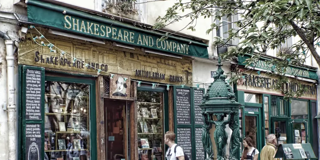 Passers-by look in the window of Shakespeare and Company bookshop