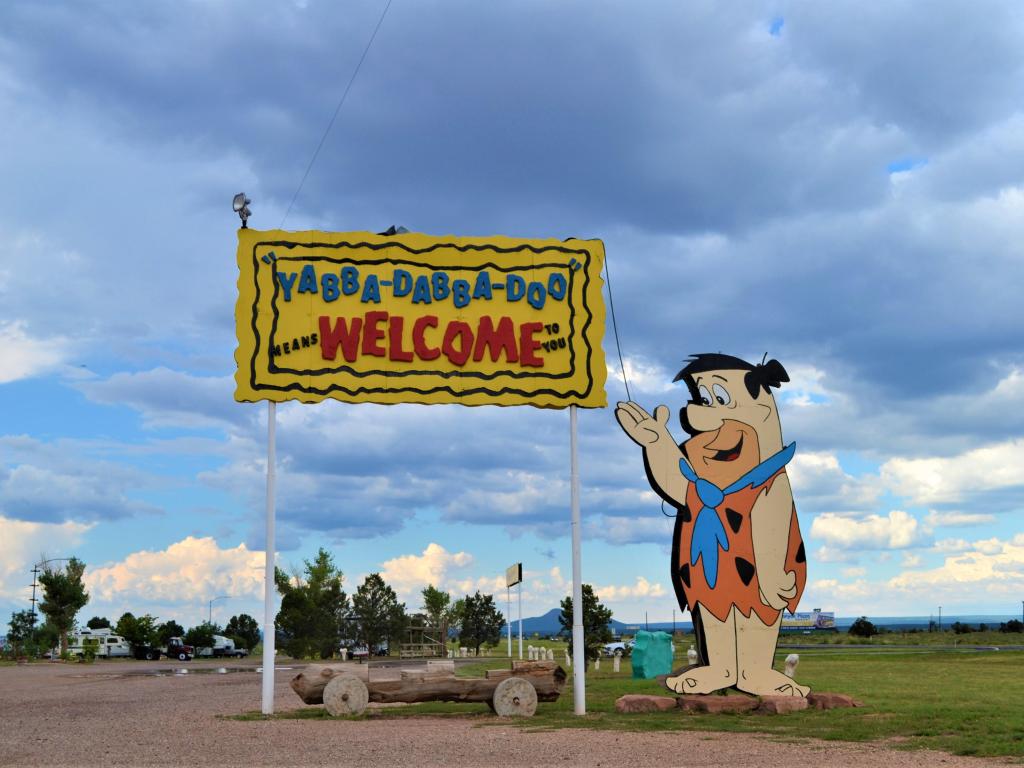 Fred Flintstone and the sign to the quirky roadside attraction
