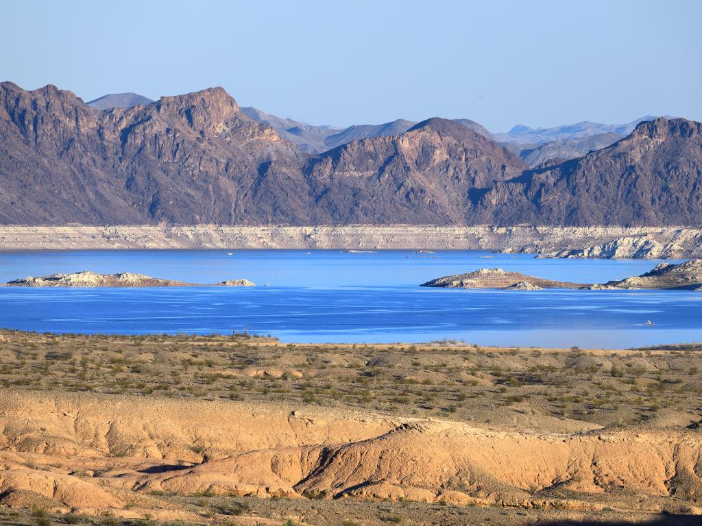 Lake Mead, Nevada/Arizona, USA with the sapphire blue Lake Mead and the barren desert landscape surrounding it taken on a sunny day.