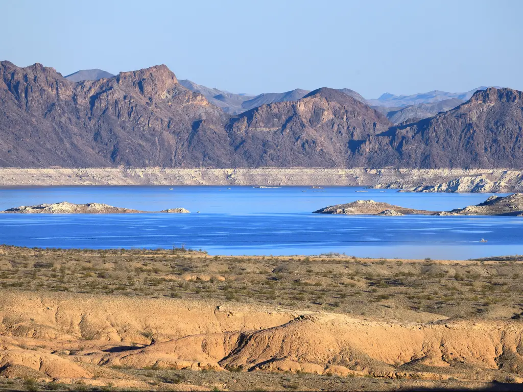 Lake Mead, Nevada/Arizona, USA with the sapphire blue Lake Mead and the barren desert landscape surrounding it taken on a sunny day.