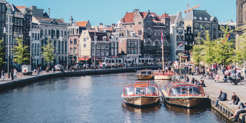 Boats waiting to take passengers on a canal cruise, Amsterdam 