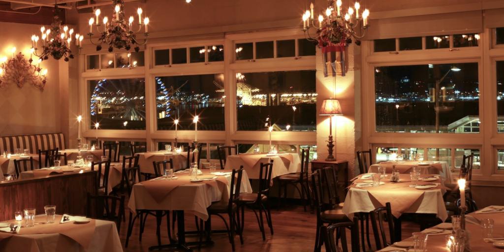 Chandeliers illuminate the Pink Door restaurant in Seattle, Washington