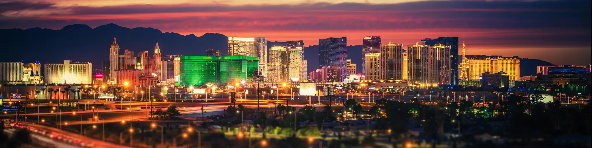 Las Vegas, Nevada, USA with the city skyline at scenic dusk with colorful lights on the buildings.