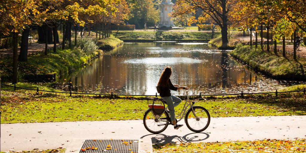Woman cycling in Berlin's Tiergarten park