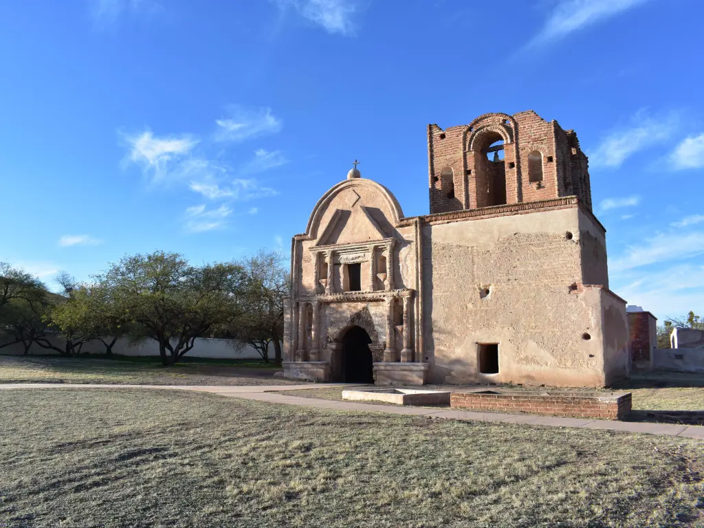 Historic buildings and grounds against clear blue skies at Tumacacori National Historic Park
