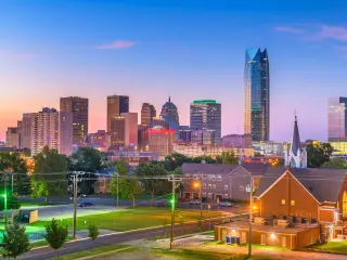 View across Oklahoma City downtown skyline at twilight.