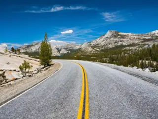 Driving through Tioga Pass in the national park on a sunny day