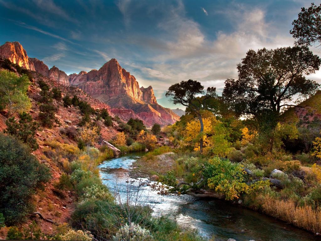 Zion National Park during a partially cloudy sunset. 