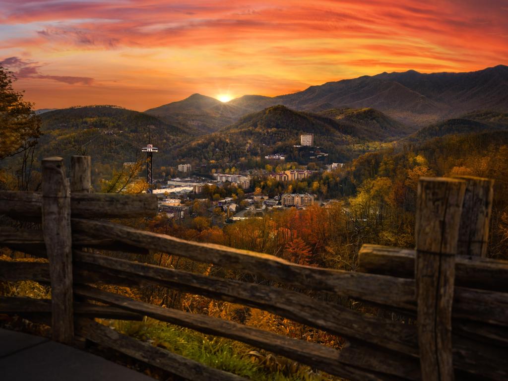 Gatlinburg, Tennessee, USA overlook during brilliant sunset with a gate in the foreground. 