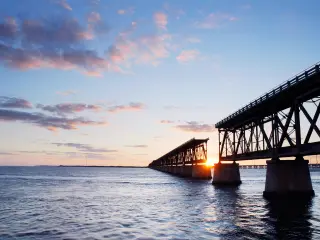 Sunset behind the historic railroad bridge at Bahia Honda State Park in the Florida Keys
