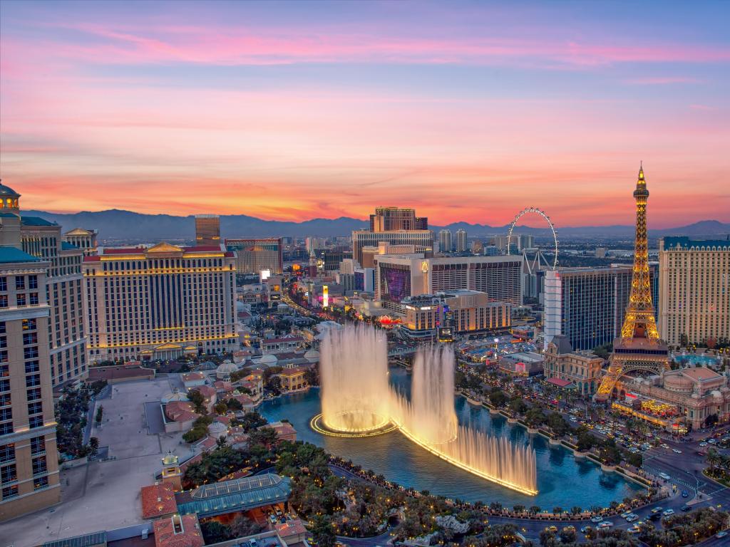 Las Vegas, USA with an illuminated view Bellagio Hotel fountains and Las Vegas strip at sunset. 