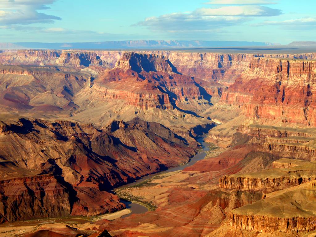 Grand Canyon National Park, USA seen from Desert View and taken on a sunny clear day with the red rocks surrounding a stream. 