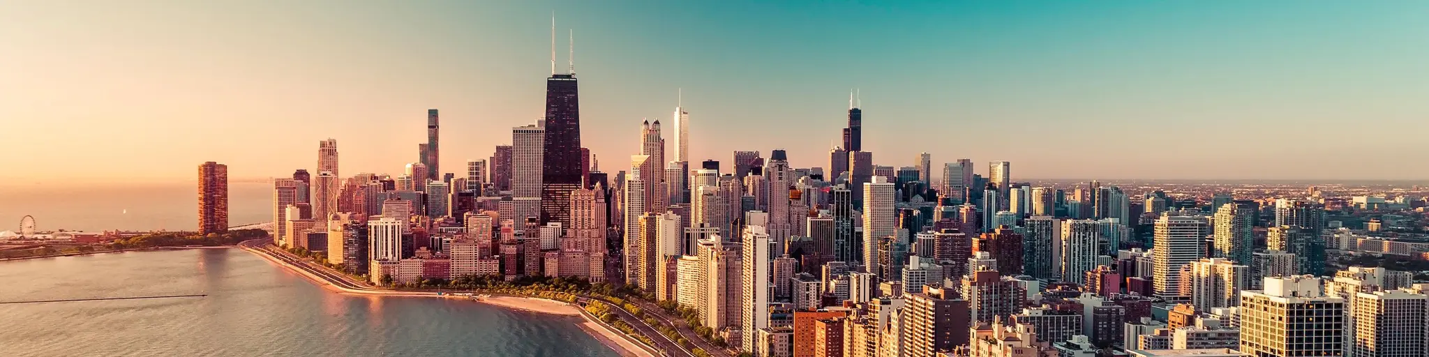 Chicago's skyline during sunrise, on the shore of Lake Michigan