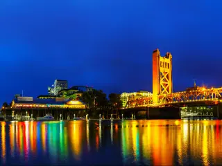 Sacramento, California, USA  with a panorama of Golden Gates drawbridge in Sacramento at night.