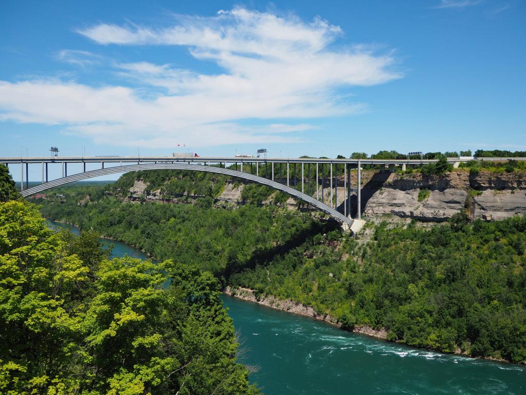 Queenston-Lewiston Bridge with lush green vegetation, across the Niagara River Gorge