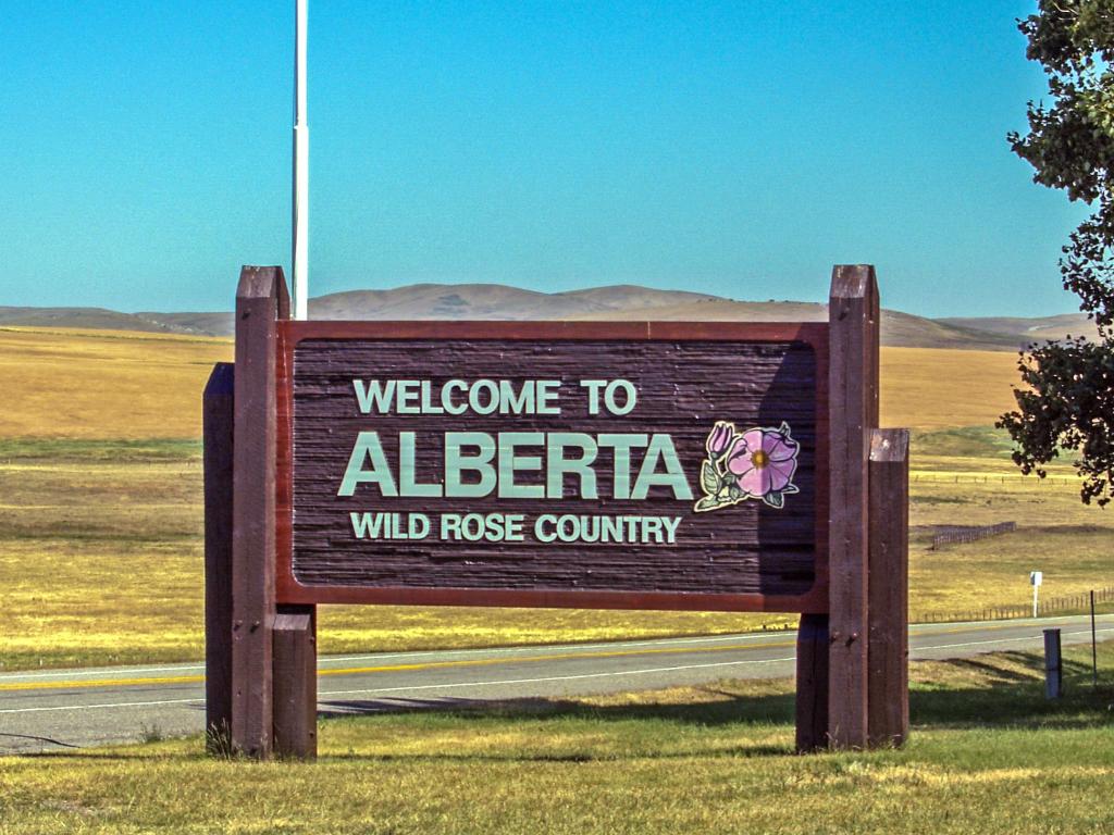 Alberta welcome sign at the province boundary with the State of Montana