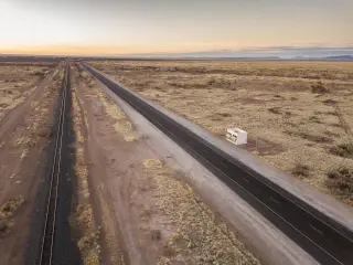 The Prada Marfa store sits alone at dawn in the middle of the desert.