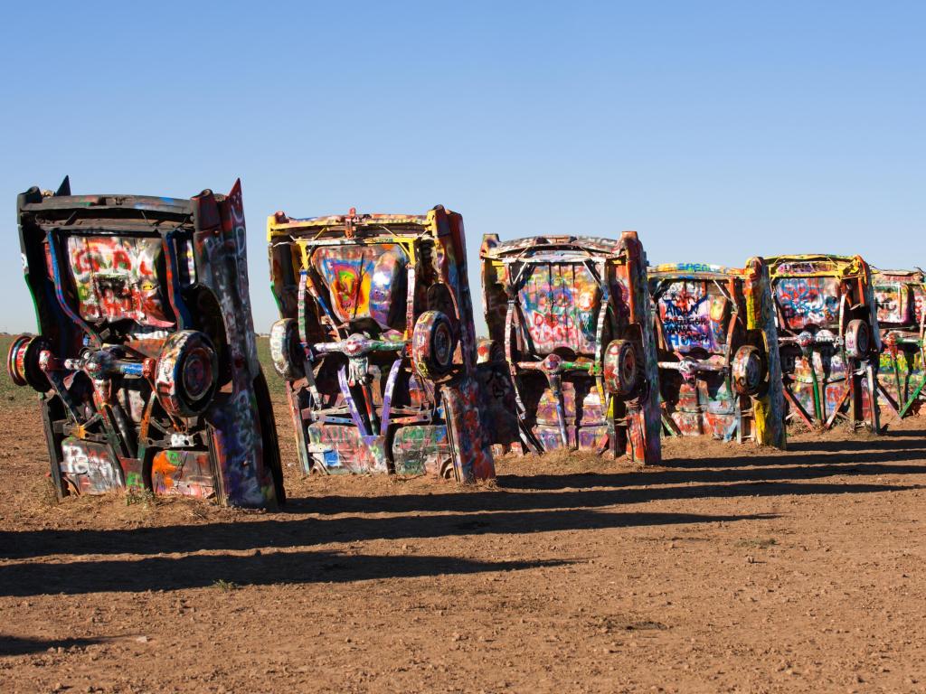  Famous art installation of the old Cadillac cars on on October 27, 2010 at Cadillac Ranch near Amarillo, Texas. Often attributed as a popular landmark of Route 66