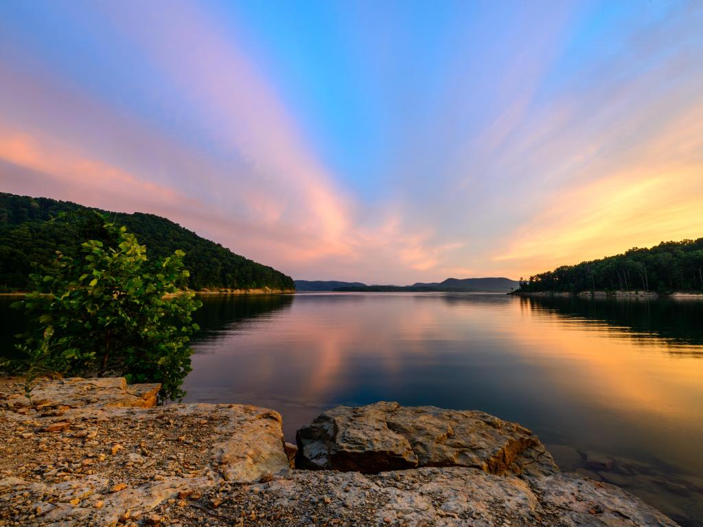 Daniel Boone National Forest, Kentucky, USA with an amazingly colorful sunset over Caverun Lake in the Daniel Boone National Forest. Captured at Windy Bay Fishing Point.