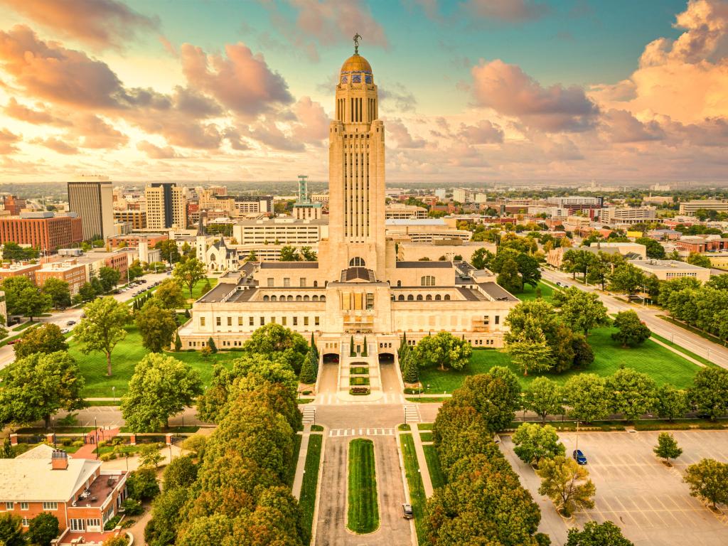 Lincoln skyline and Nebraska State Capitol. The Nebraska State Capitol is the seat of government for the U.S. state of Nebraska and is located in downtown Lincoln.