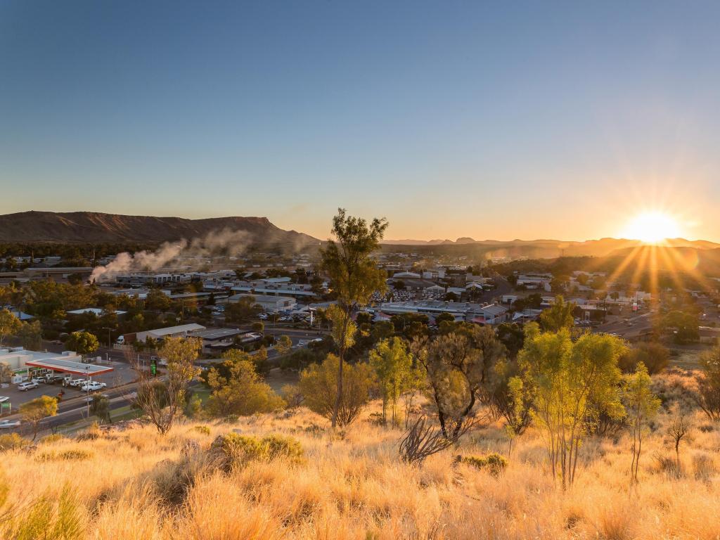 Alice Springs, Australia with a view of Alice Springs in the distance taken at sunset.