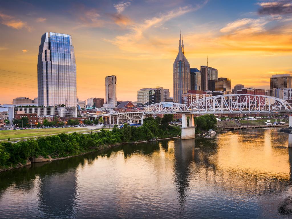 Nashville, Tennessee, USA Skyline of downtown Nashville, Tennessee, USA taken at early sunset with the river in the foreground.