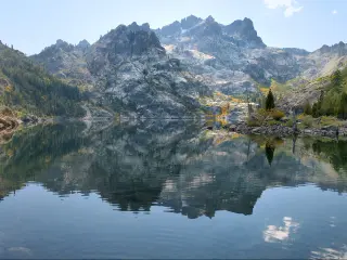 Sierra Buttes and the Upper Sardine Lake in the Tahoe National Forest, California.