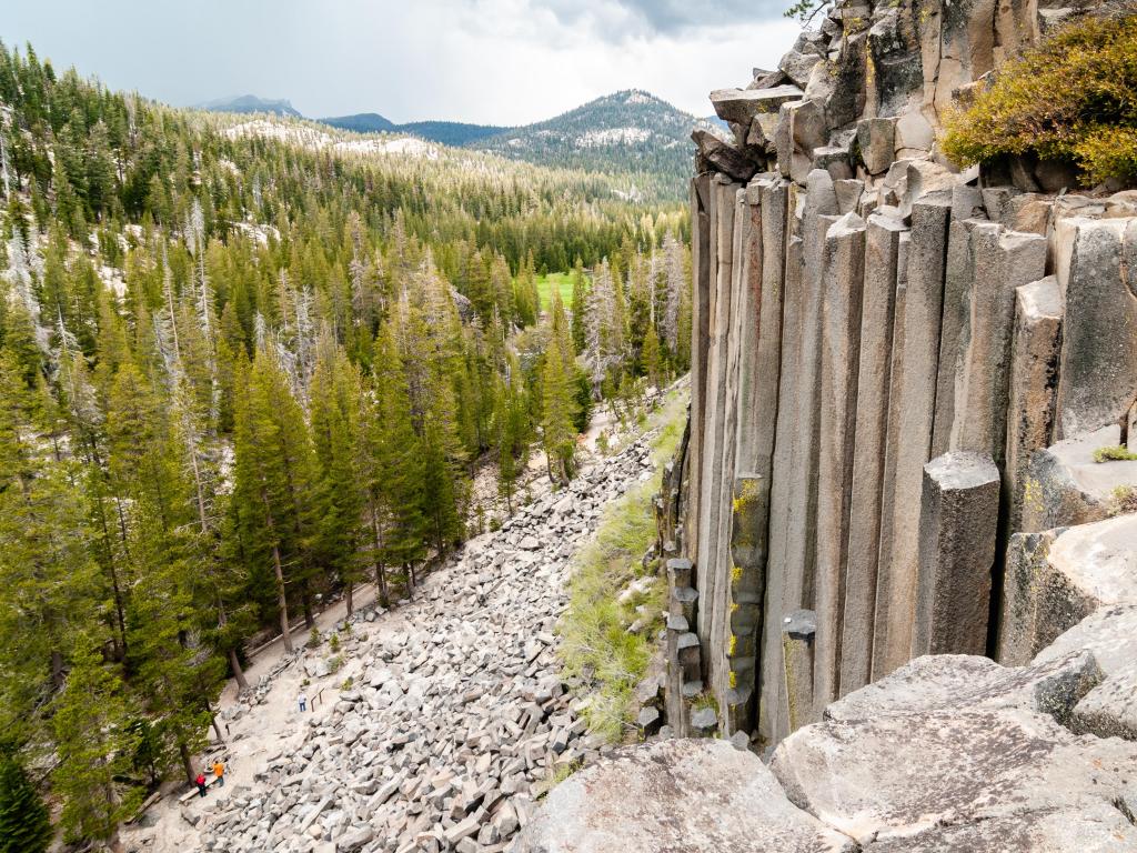 Hexagon basaltic columns seen from the top of Devils Postpile National Monument in Inyo National Forest on a cloudy day. 