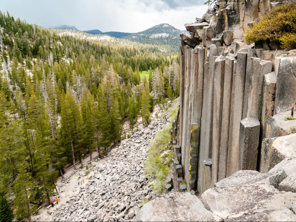 Hexagon basaltic columns seen from the top of Devils Postpile National Monument in Inyo National Forest on a cloudy day. 