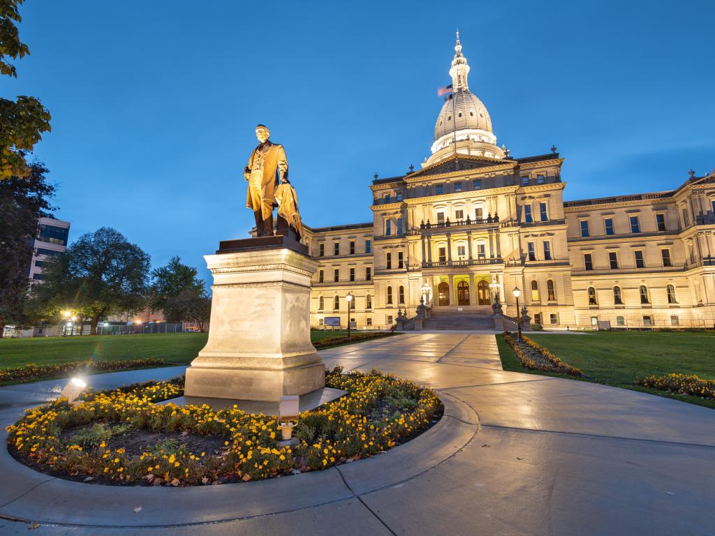 Statue in the foreground with state capitol building behind