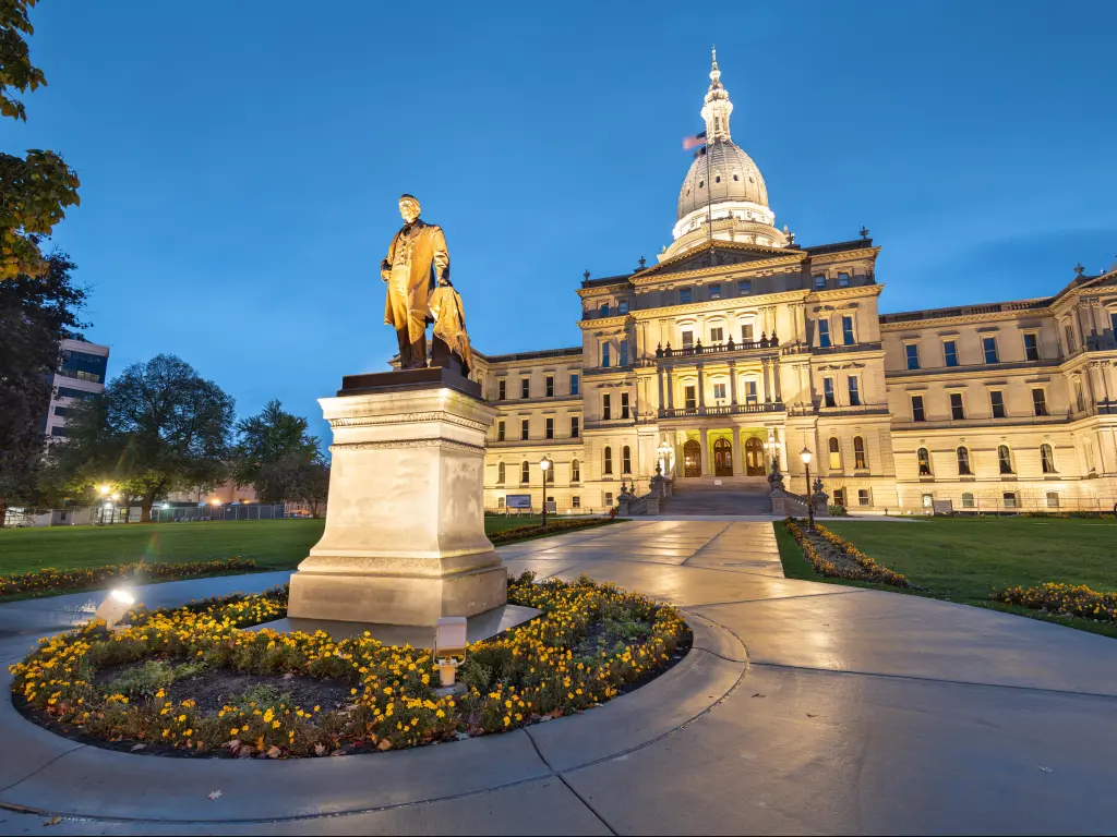 Statue in the foreground with state capitol building behind