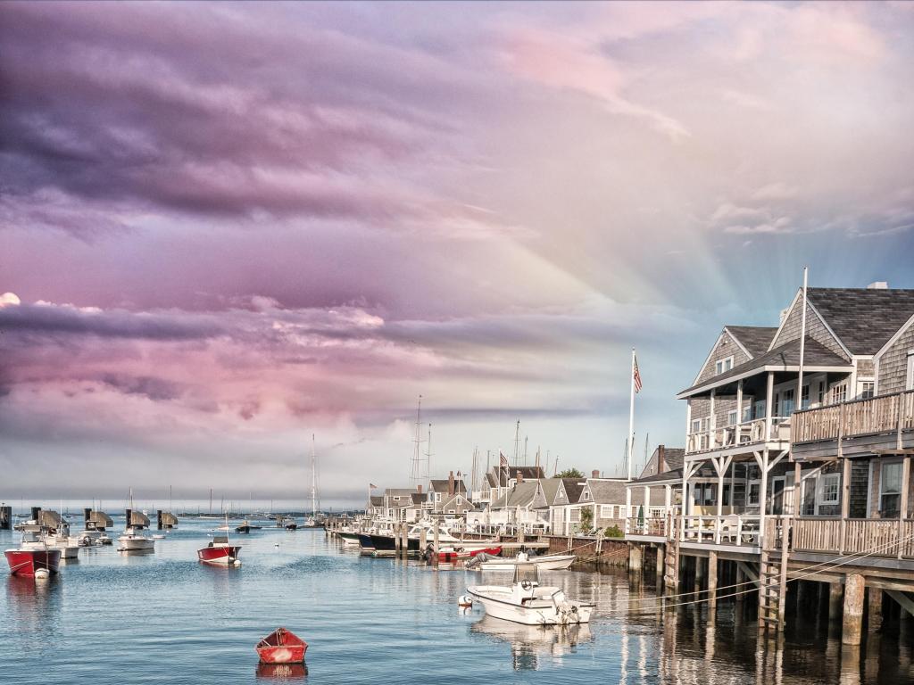 Beautiful homes of Nantucket, Massachusetts. Houses over water at dusk.
